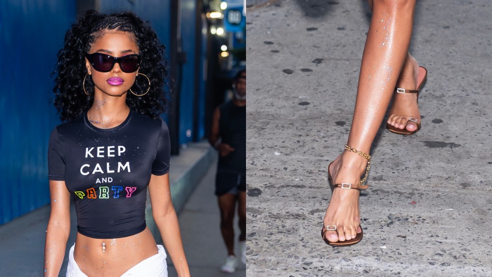 wwd's tweet card. Tyla donned a pair of satin Amina Muaddi sandals to go with frayed shorts and a crop top in New York City on Thursday.