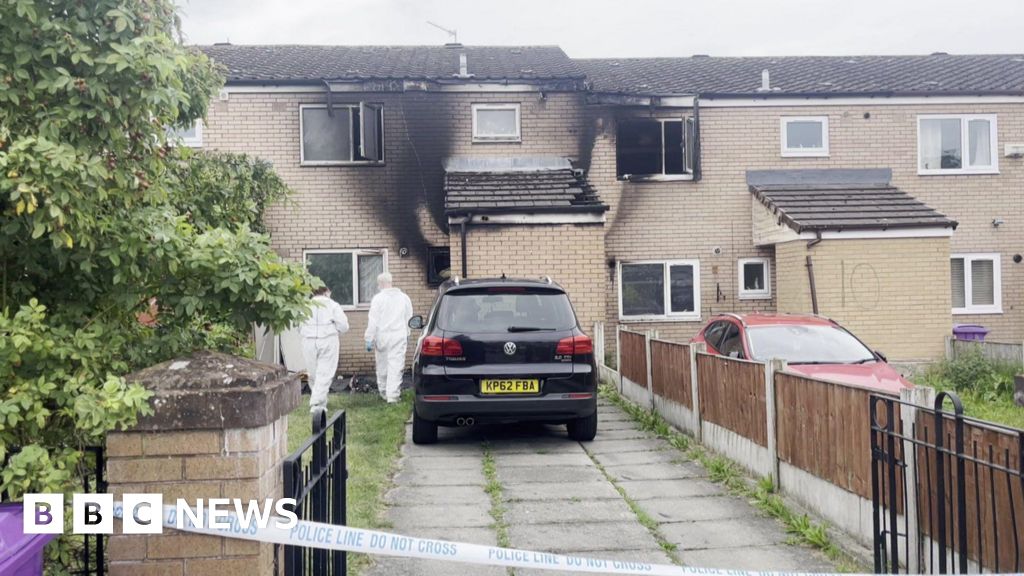 BBCNWT's tweet card. Police said petrol had been poured into the front porch of one of the homes before it spread next door.