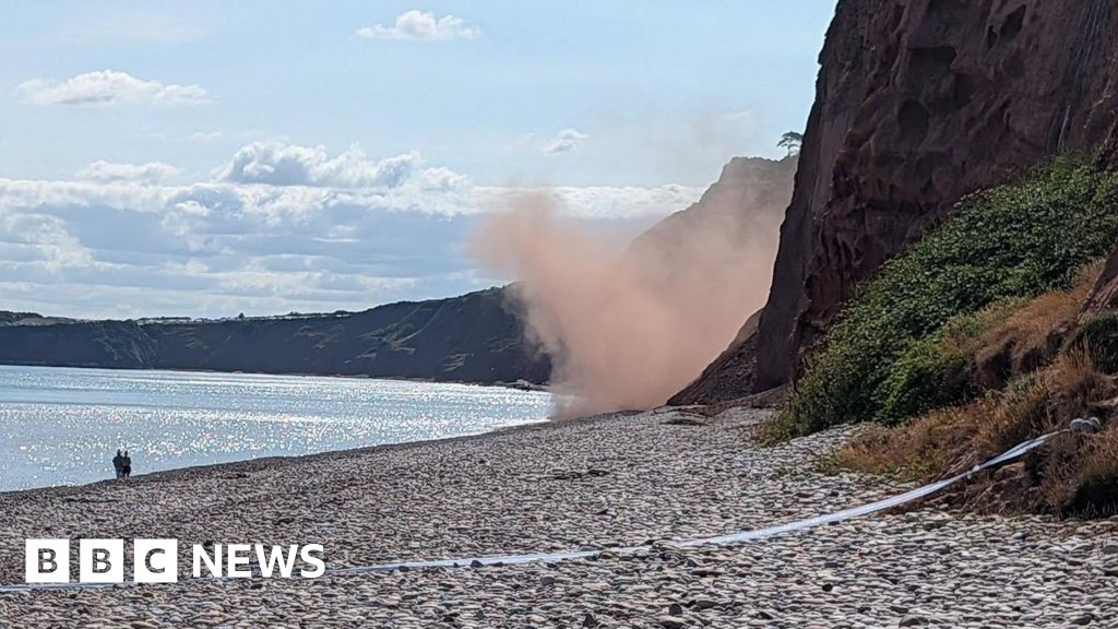 BBCSpotlight's tweet card. Two people become stranded on the wrong side of a cliff fall and have to be rescued.