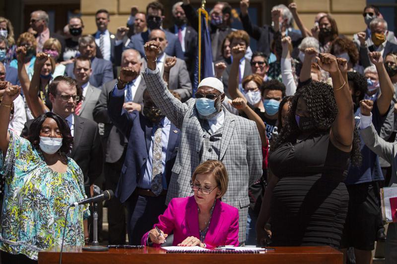 tdorman's tweet card. Iowa Gov. Kim Reynolds signs bipartisan legislation June 12, 2020, on the steps of the Iowa State Capitol in Des …