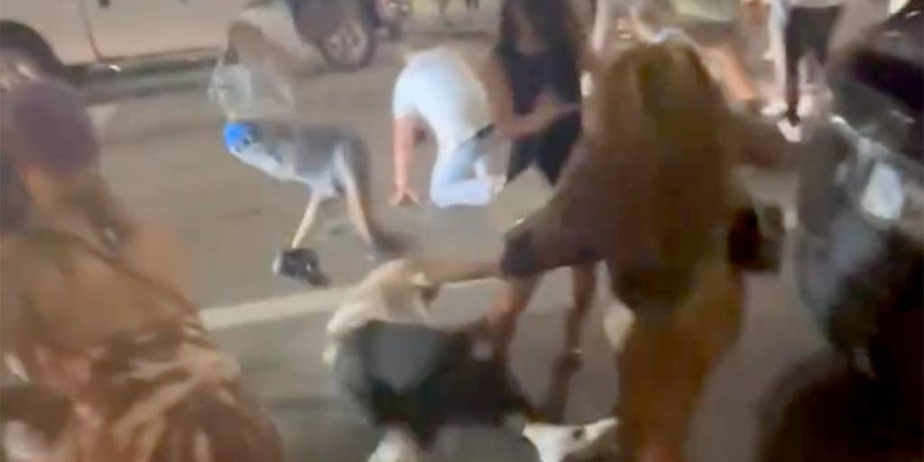 antisafespaces's tweet card. A viral video of a downtown Cincinnati brawl shows multiple attackers assaulting a man and woman, prompting a police investigation to identify all individuals involved.