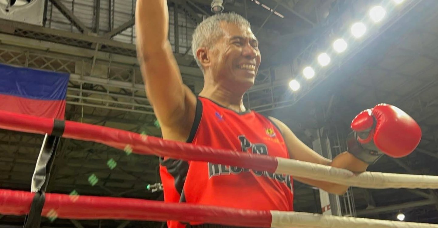 WhenInManila's tweet card. The boxing match that we didn't see coming! Philippine National Police Chief Gen. Nicolas Torre III won by default at the "Boxing for a Cause" match against