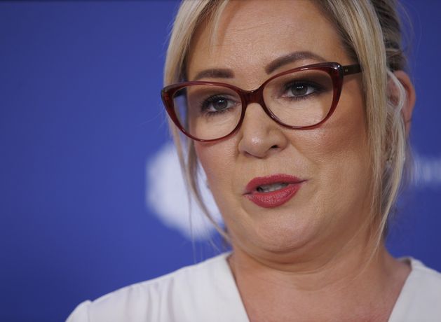 OpenMinded_21's tweet card. First Minister Michelle O’Neill has been a accused of a “pathetic attempt to rewrite history” after describing how the killing of local people by “the Brit...