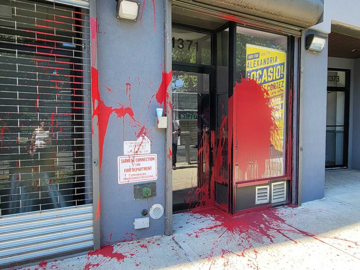 bronxtimes's tweet card. When the Bronx Times visited later that morning, large splashes of red paint covered the campaign poster near the door. Earlier news photos showed a sign