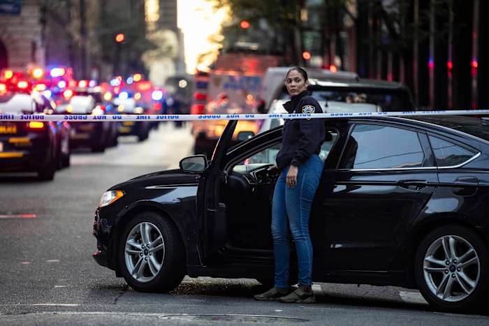 wsls's tweet card. At least two people, including a New York City police officer, were shot Monday in a midtown office building that houses some of the country’s top financial firms and the National Football League.