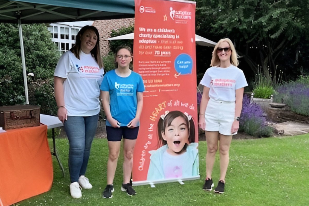 standardchester's tweet card. A garden party has raised more than £1,000 in support of adoption services.
