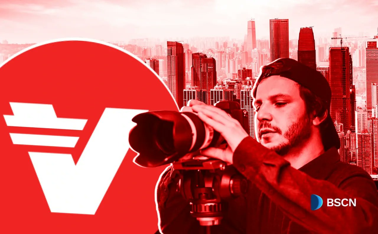 A person using a camera with a city skyline and the Verasity logo in the background