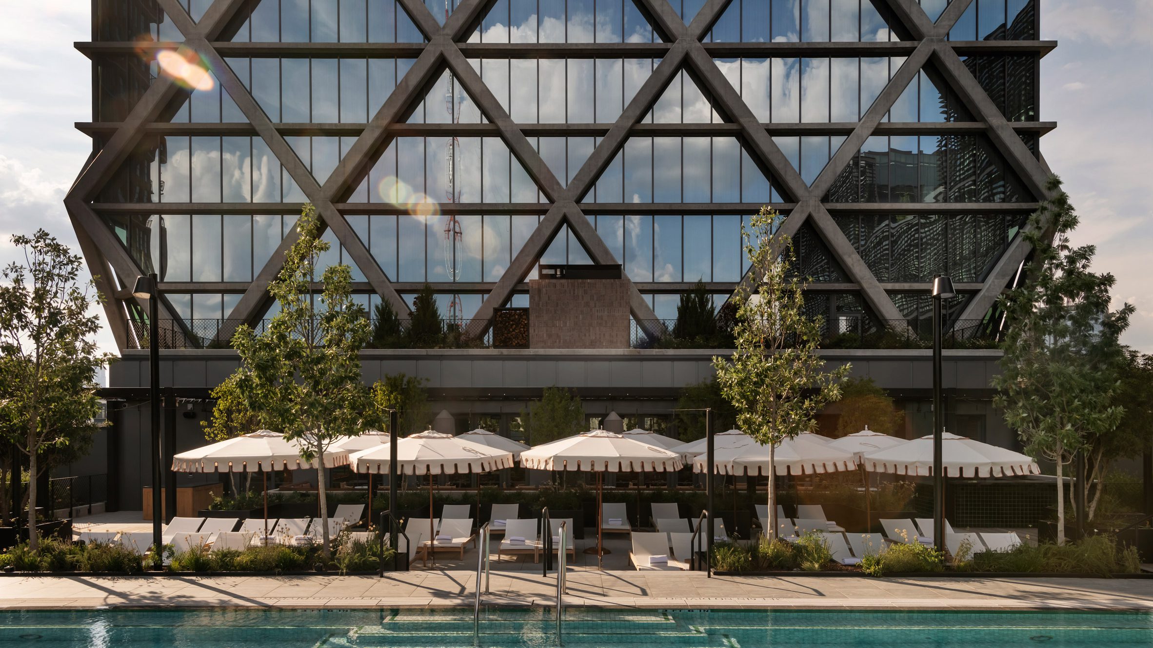 urmca's tweet card. Morris Adjmi Architects has used external, criss-crossing concrete beams as the primary structure for this hotel and members club in Atlanta, Georgia.