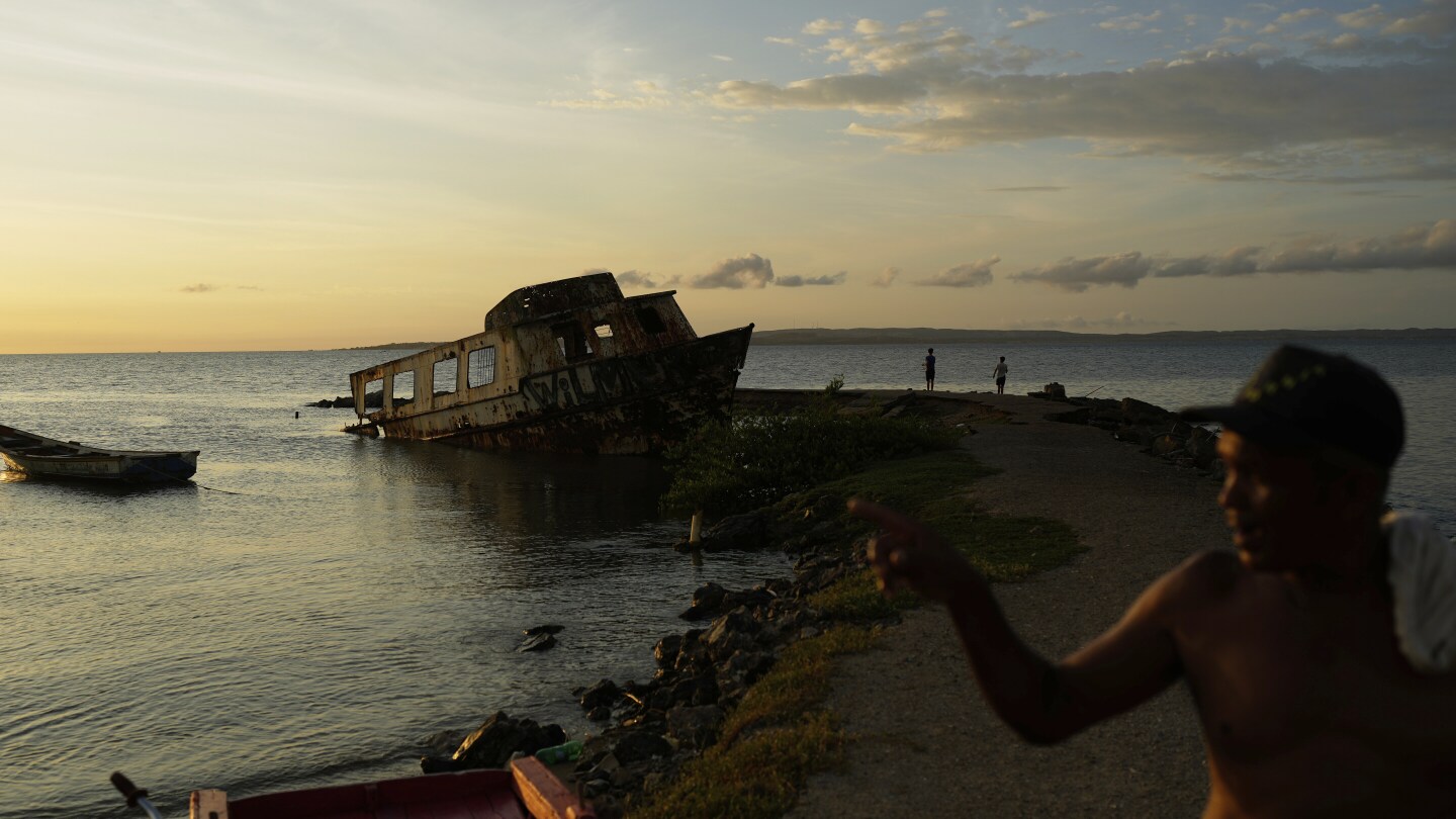 AP_Images's tweet card. Photographer Ariana Cubillos describes it as a sensation of what was once prosperous country and full of life, has now turned into scenarios of abandonment.