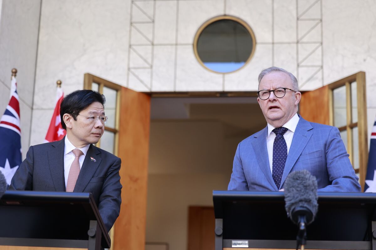 business's tweet card. Australia and Singapore are in discussions to boost bilateral defense ties, including enhanced reciprocal access to naval and air bases, Prime Minister Lawrence Wong said on Wednesday.
