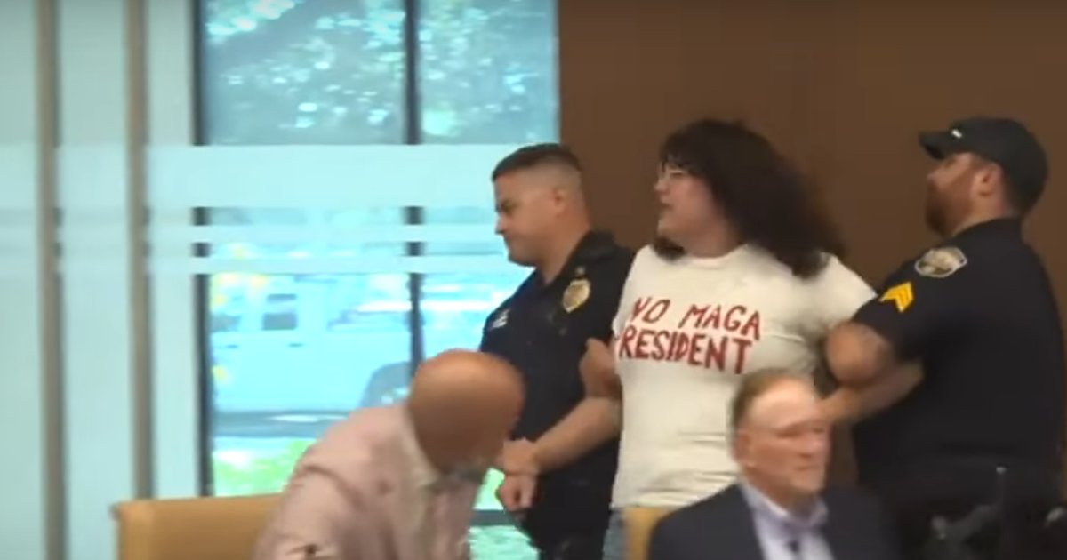 lgbtqnation's tweet card. She earned a felony arrest for speaking too long, then was strip-searched and warned she'd be raped.