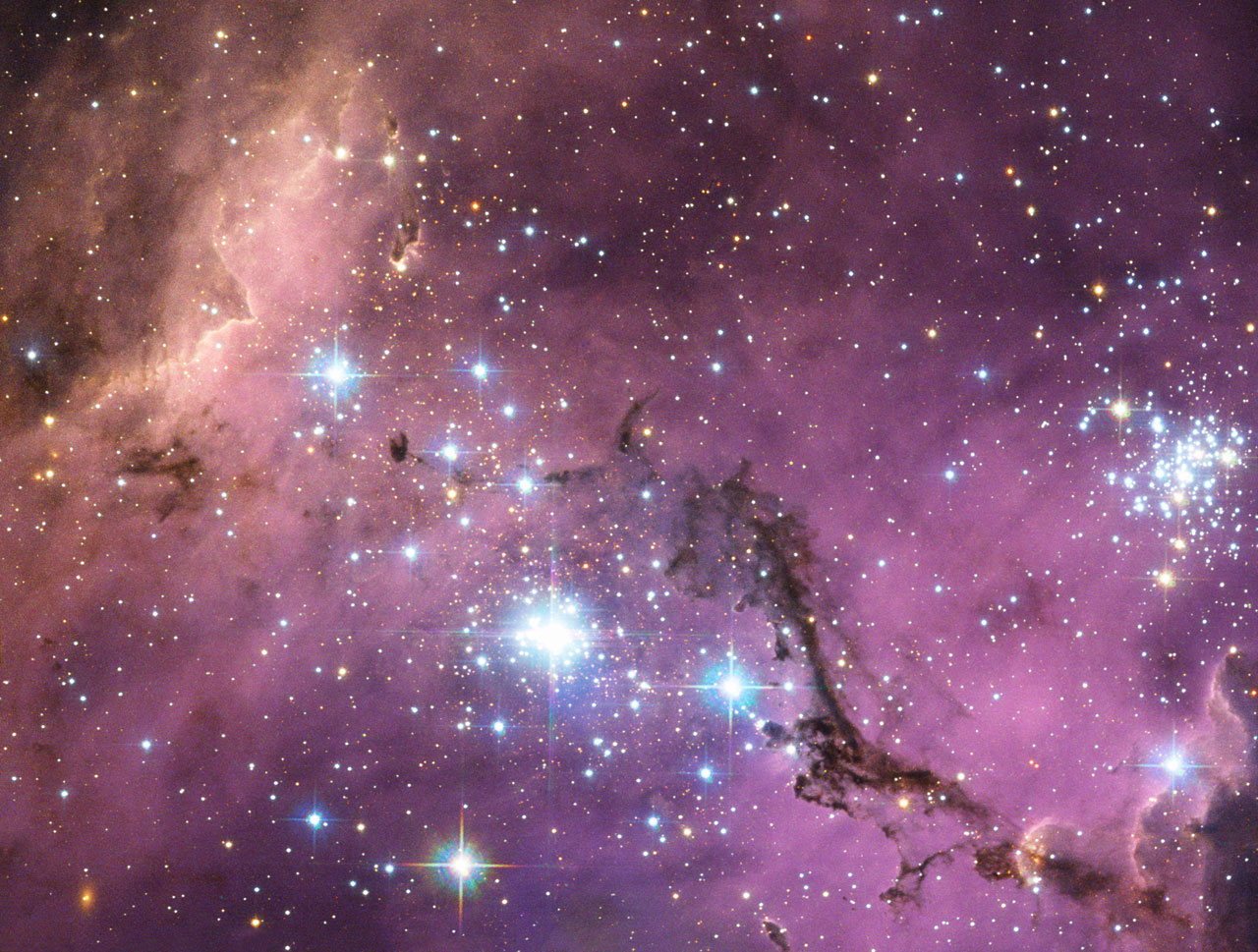 ESA_de's tweet card. Nearly 200 000 light-years from Earth, the Large Magellanic Cloud, a satellite galaxy of the Milky Way, floats in space, in a long and slow dance around our galaxy. Vast clouds of gas within it...
