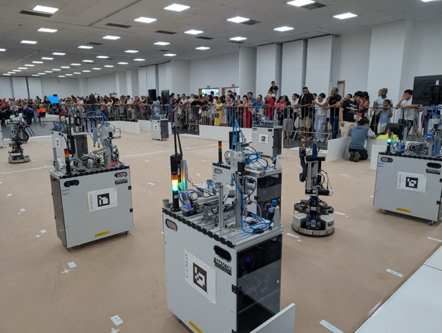 Robohub's tweet card. RoboCup Logistics League: an interview with Alexander Ferrein, Till Hofmann and Wataru Uemura -...