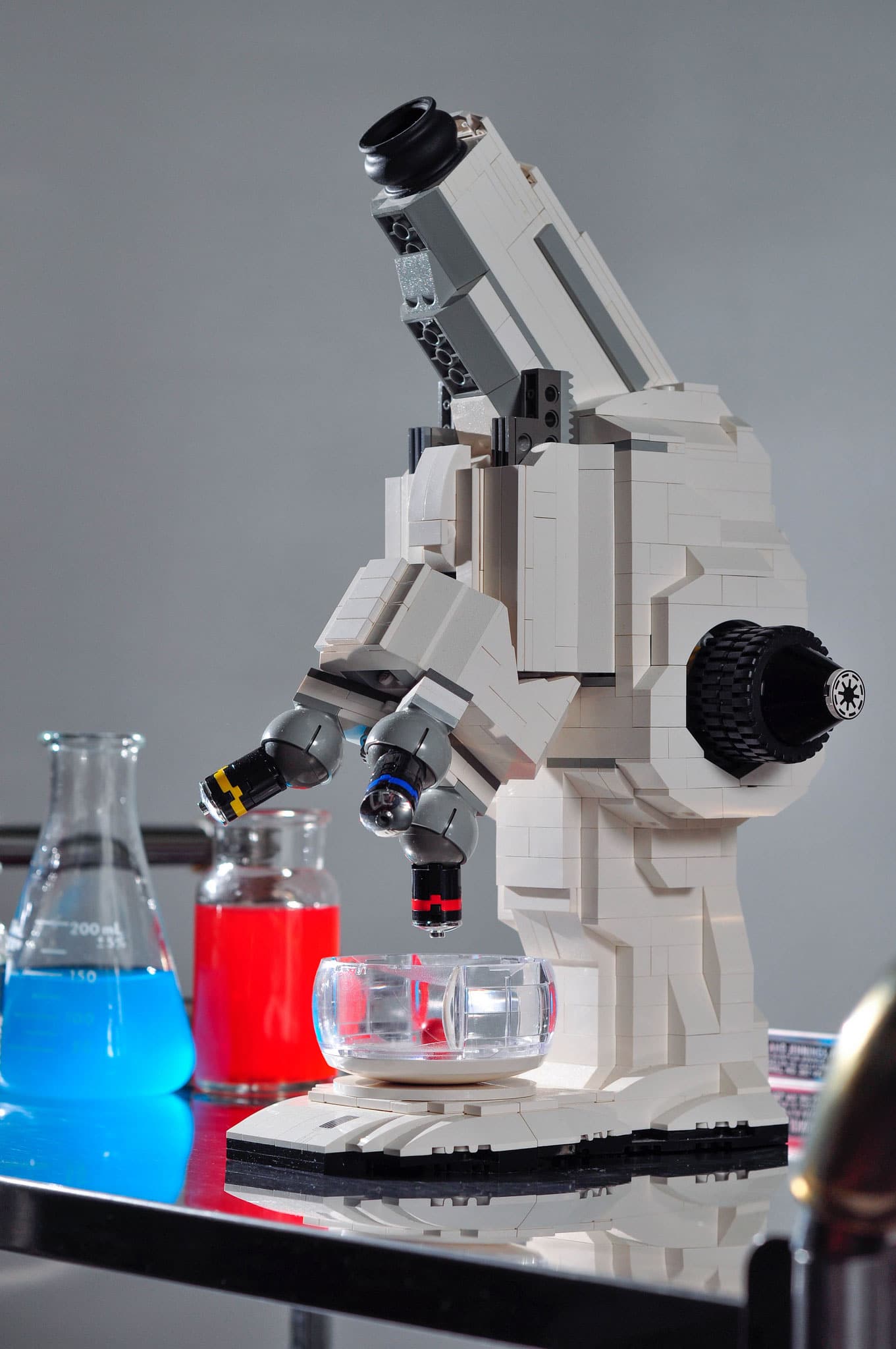 retrogeekus's tweet card. Behold science geeks...this is a functional microscope built entirely from LEGO bricks. It is inspired by the pod from the discontinued LEGO X-Pod sets.