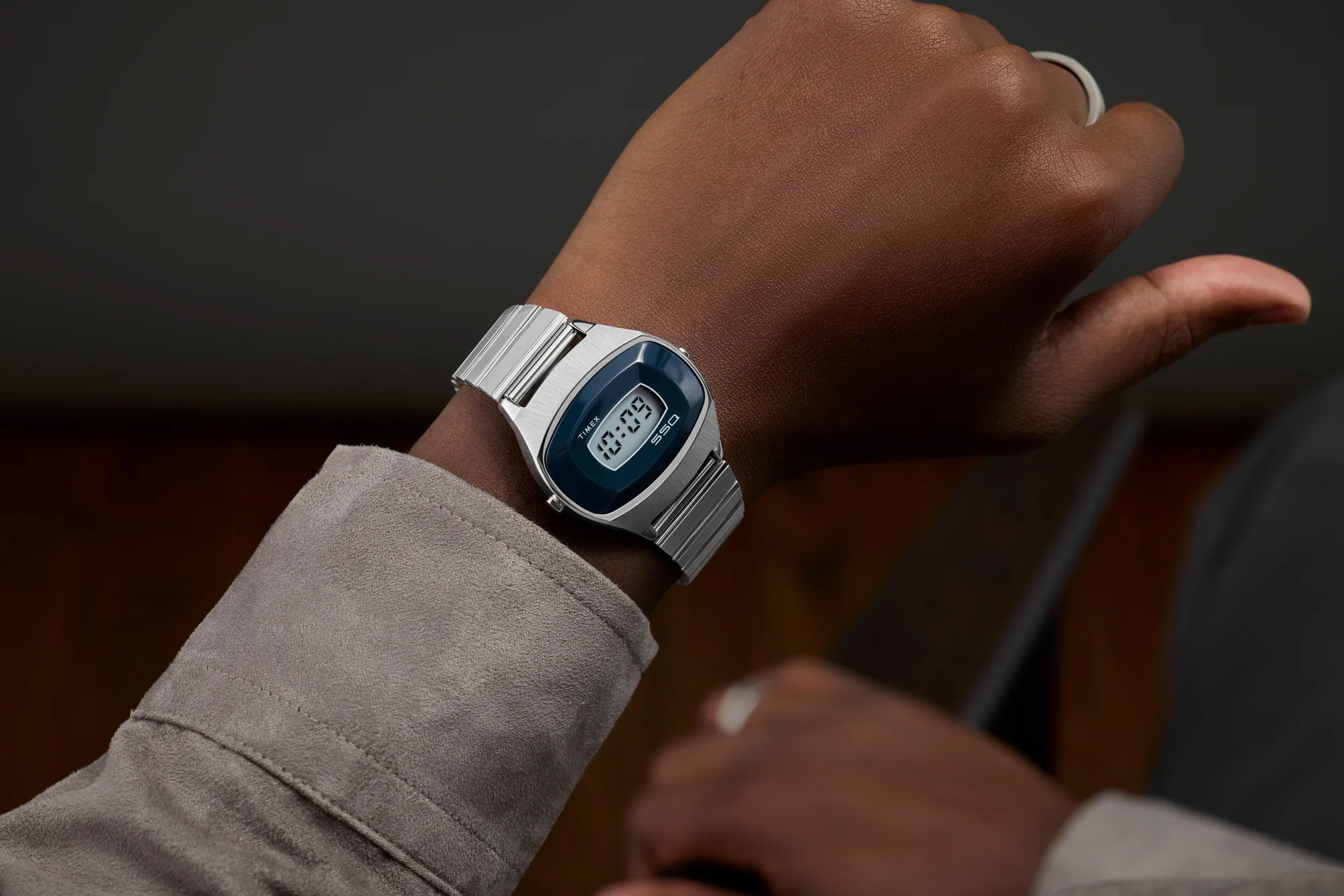 Gadget_Bond's tweet card. Timex is celebrating 50 years of LCD innovation with the return of its 1975 SSQ digital watch, blending retro design and modern craftsmanship.