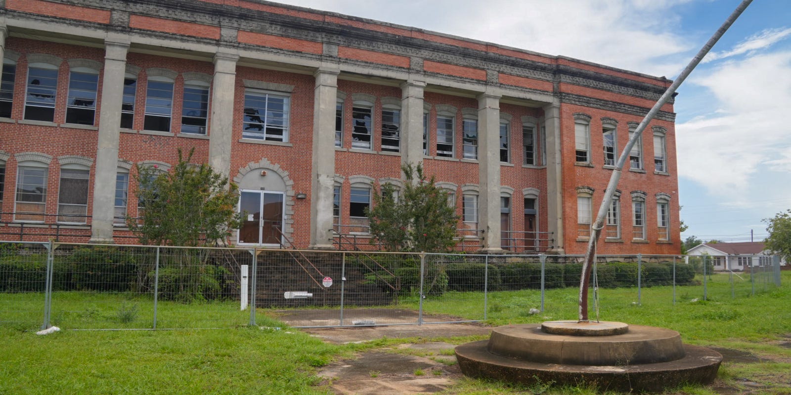 FLRedevel's tweet card. The Panama Grammar School building has been slowly decaying since Hurricane Michael. The city commission wants to do something about it.