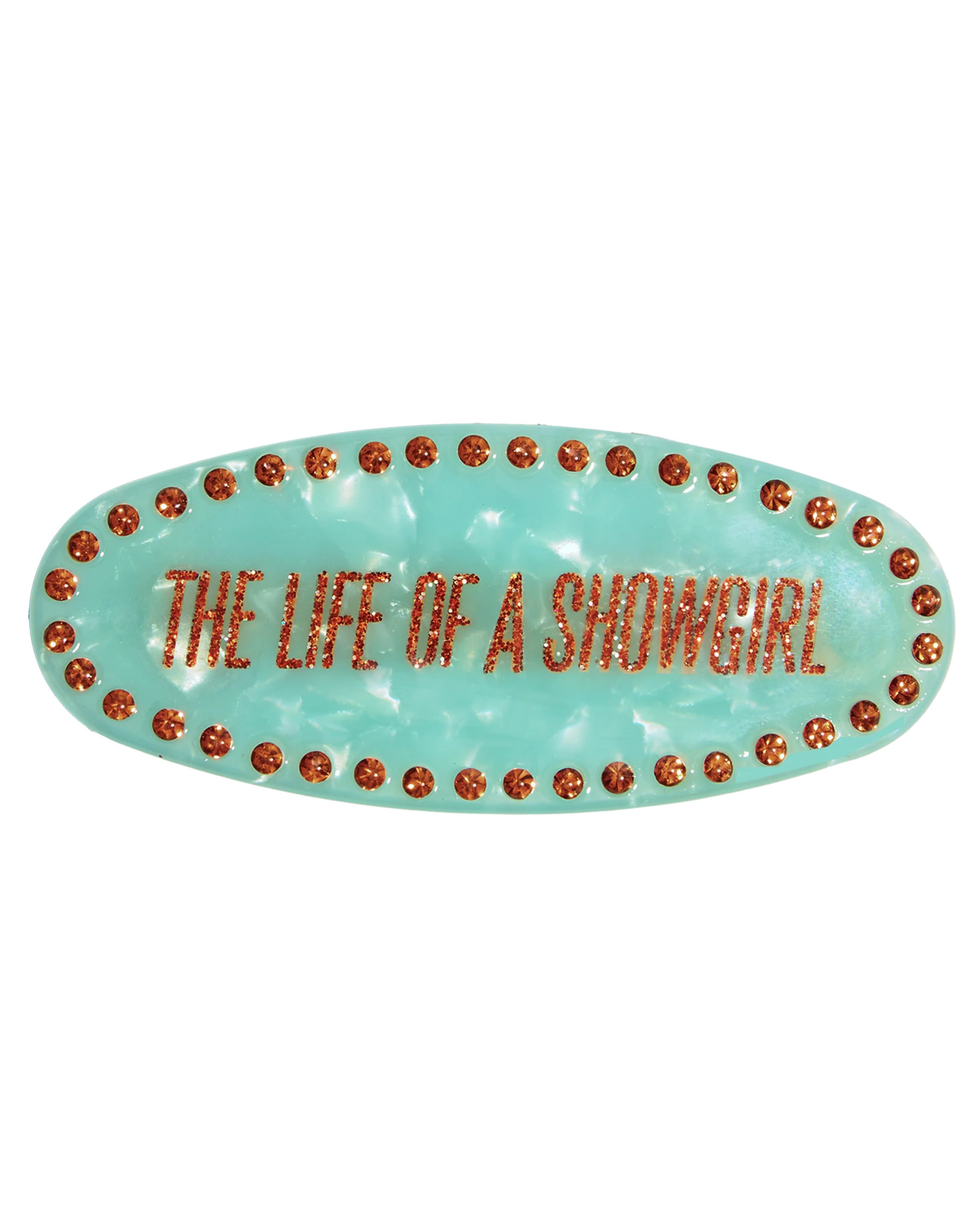 Alerts4Merch_CA's tweet card. MINT GREEN PEARLESCENT BARRETTE FEATURING "THE LIFE OF A SHOWGIRL" ALBUM LOGO IN ORANGE SPARKLE PRINTED ON FRONT OF BARRETTE WITH ORANGE RHINESTONES.   CELLULOSE ACETATE, RHINESTONES6.4 X 2.5CM  ...