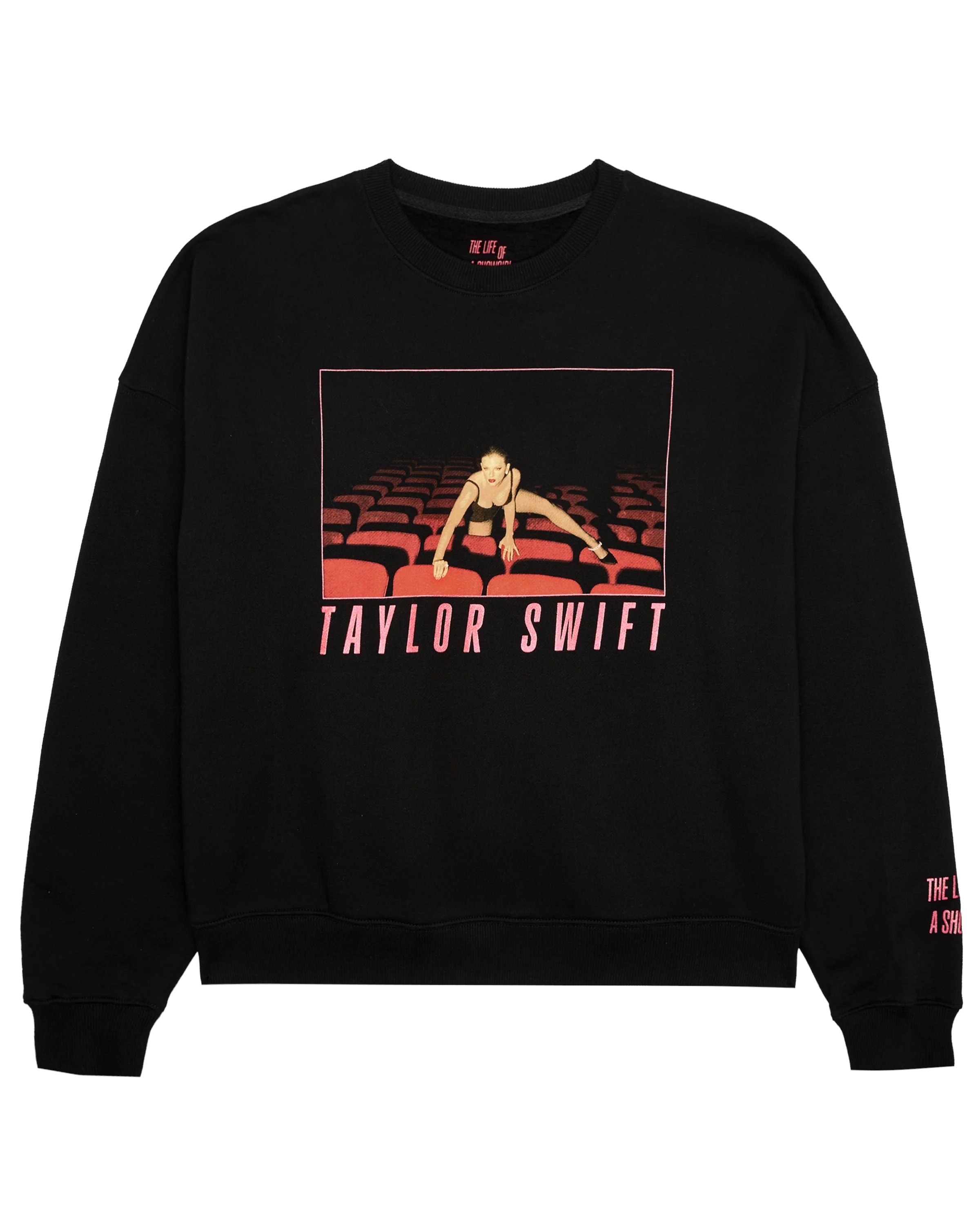 Alerts4Merch_CA's tweet card. BLACK LONG SLEEVE CREWNECK SWEATSHIRT FEATURING "TAYLOR SWIFT" LOGO IN RED SPARKLE AND PHOTO OF TAYLOR SWIFT WITH RED SPARKLE BORDER PRINTED ON FRONT WITH "THE LIFE OF A SHOWGIRL" ALBUM LOGO PRINTED...
