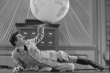 SlapstickFest's tweet card. Alasdair and Robin introduce this special big screen outing of Chaplin’s masterful and timely satire.  They will explore how Chaplin skillfully used comedy to