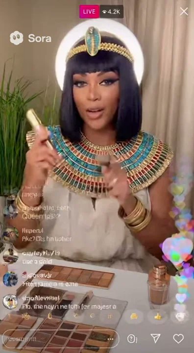 polygrafix's tweet card. Cleopatra doing a livestream makeup tutorial on tiktok