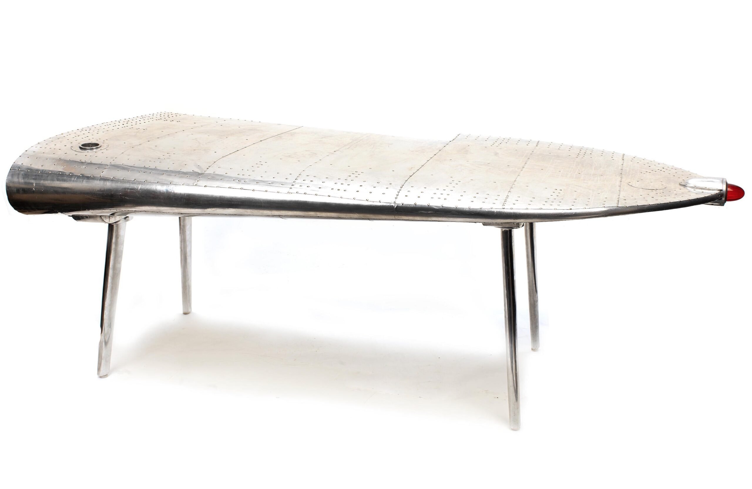 Silodrome's tweet card. This is an office desk that's been made using an authentic wingtip from a Douglas DC-3, or more specifically from a Dakota DC-3, which was the military