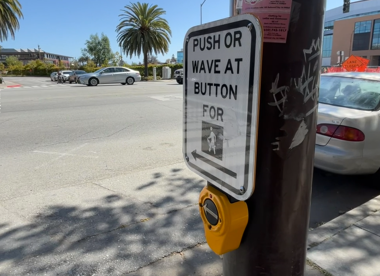 deepeddyinfosec's tweet card. Crosswalk buttons along the mid-Peninsula appear to have been hacked, so that when pressed, voices professing to be Mark Zuckerberg or Elon Musk begin speaking.