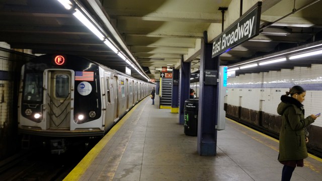 A man who had just exited the East Broadway subway station was slashed in the face Monday morning in a unprovoked attack.