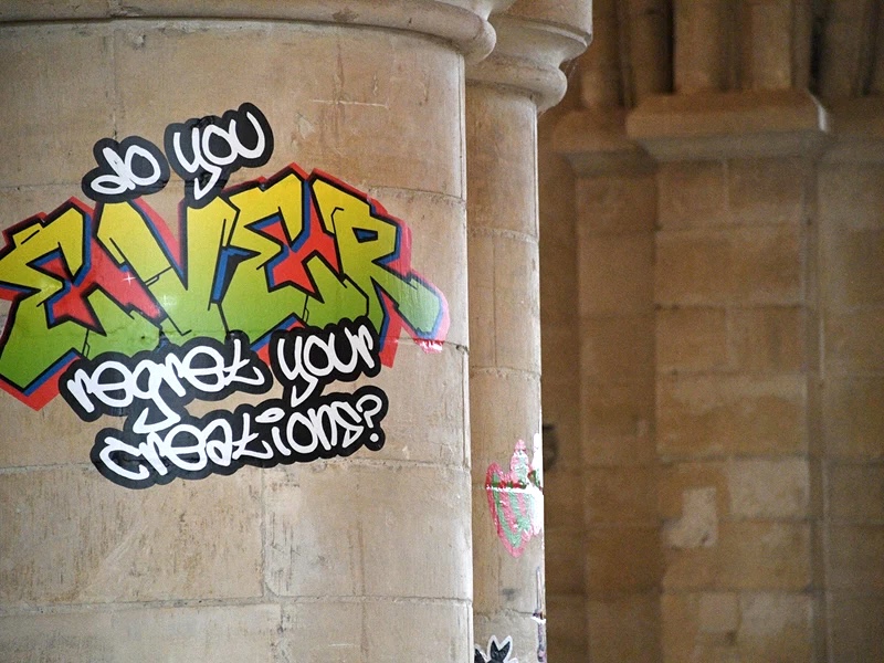 spectator's tweet card. Canterbury Cathedral’s latest art installation has caused controversy by covering its ancient walls in graffiti stickers.