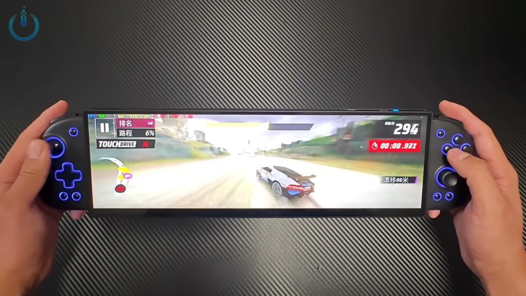 TechCommuters's tweet card. An apparently custom-made handheld gaming PC showed up on YouTube with an unwieldy 32:9 screen.