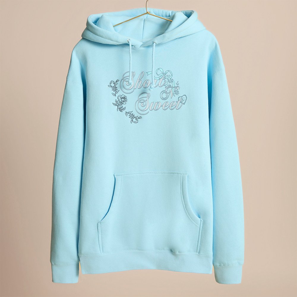 sabrinamerch_py's tweet card. stay cozy while working late....'cause you're a singer. baby blue pullover hoodie with embroidered floral accents and screenprinted logo.