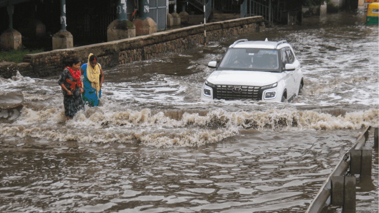 YTKDIndia's tweet card. Heavy waterlogging is seen near the Civil Hospital, Iffco Chowk metro station and other areas, leading to severe traffic congestion in the city., Gurugram News, Times Now
