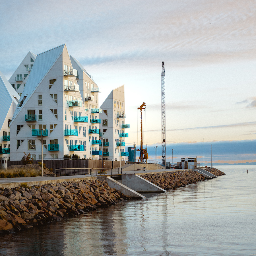 dynamic_forms's tweet card. The Iceberg - Aarhus, Denmark - The residential complex „Isbjerget" built in 2013 on the waterfront of the Aarhus Docklands mimics floating icebergs of the north Atlantic. architecture photo report...