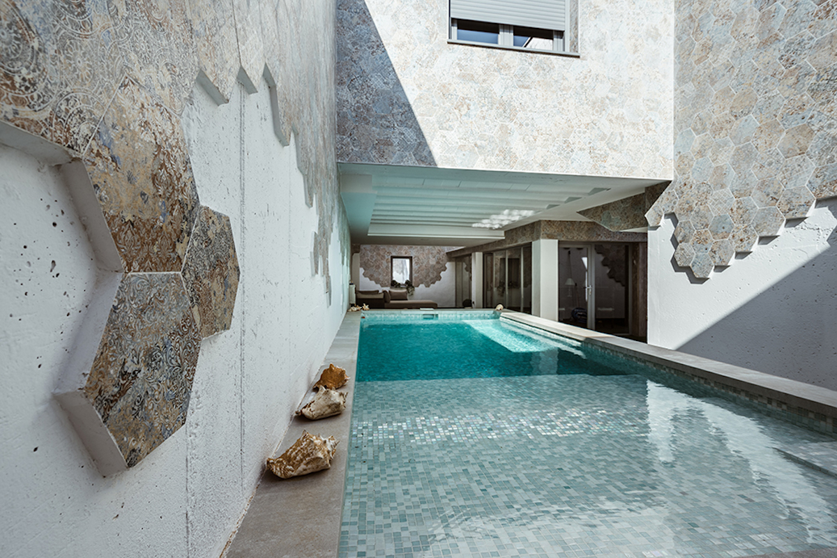 ProjectcoreInc's tweet card. OOIIO Architecture completed the GAS House in Toledo, Spain, with four patios that serve as light wells and for natural ventilation.