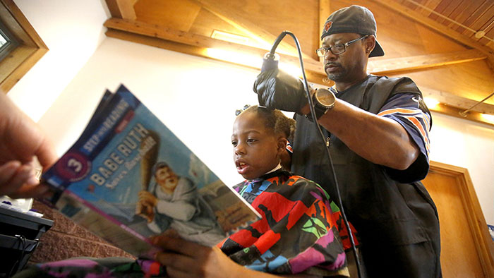 mraspinall's tweet card. This Barber Gives Free Haircuts To Children Who Read To Him