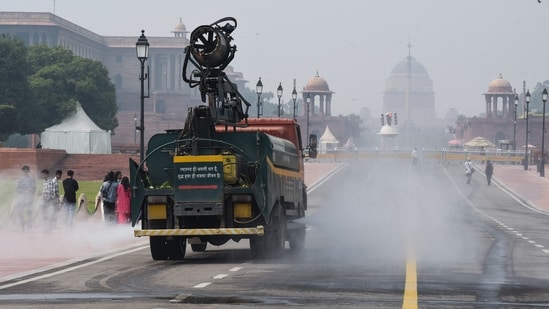 Smog Gun sprays water to control pollution levels as Air Quality dropped to poor category near Rashtrapati Bhawan, in New Delhi on Sunday. (ANI Photo/ Sumit)