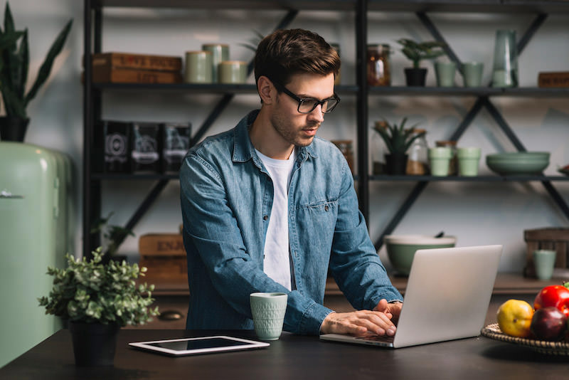 WebDesignSmarty's tweet card. What is the first thought that you have when you hear the term "remote workers"? Do they wake up at noon, work from the couch in their pajamas,