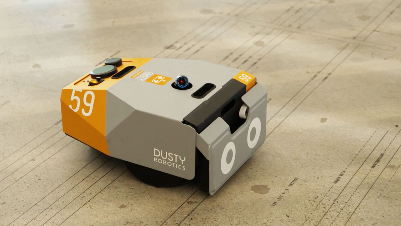 DustyRobotics's tweet card. Companies like Canvas and Dusty Robotics are using artificial intelligence and robots to speed up construction when a decreasing workforce can’t meet demand.