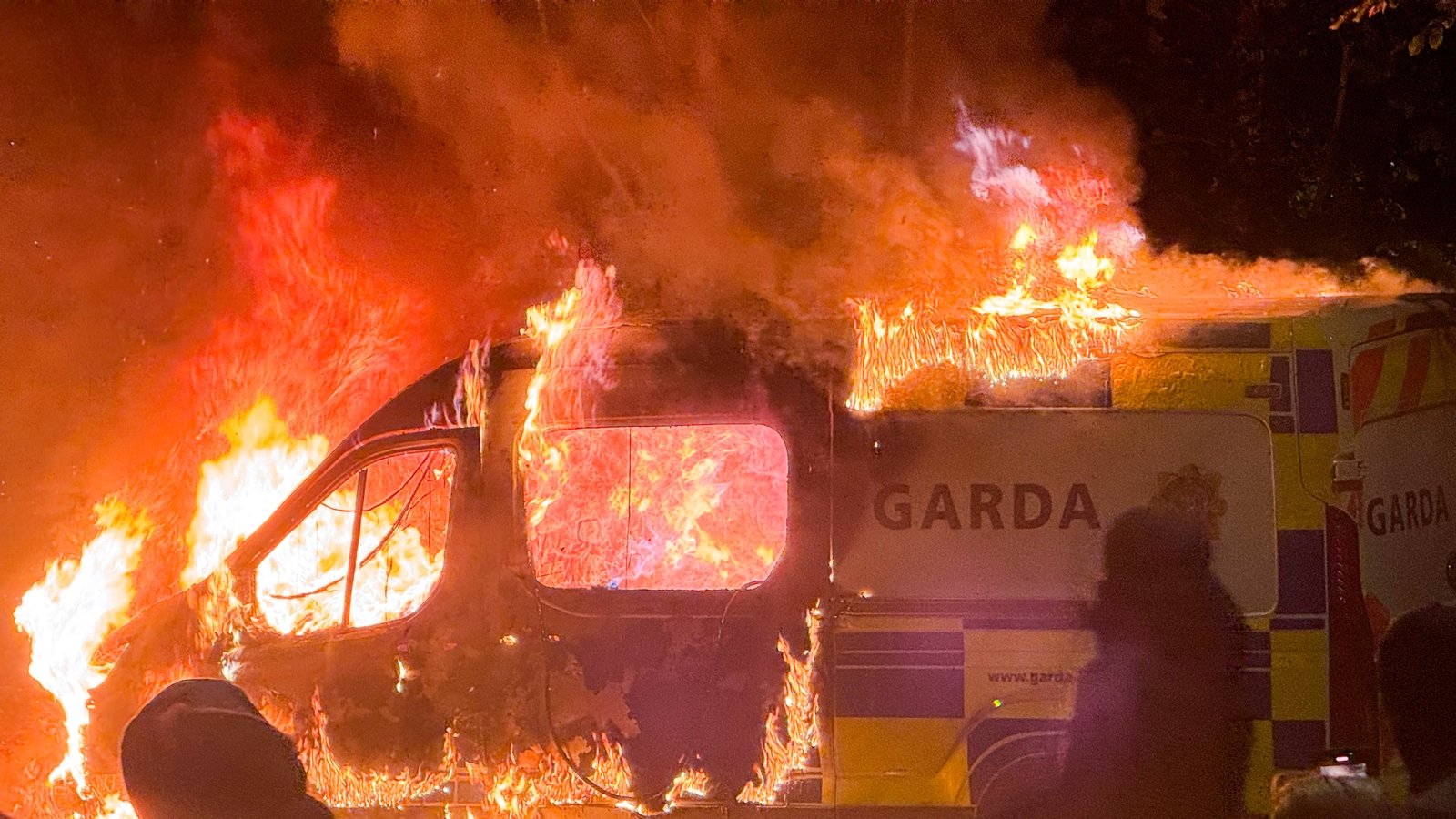 rtenews's tweet card. Gardaí have begun clearing protesters from in front of the entrance of the IPAS centre at Citywest in Dublin.
