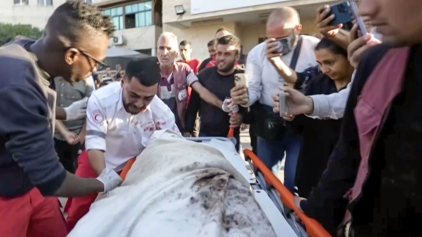 AP's tweet card. A Palestinian ambulance worker in Gaza was devastated to realize he was carrying his own mother's body.