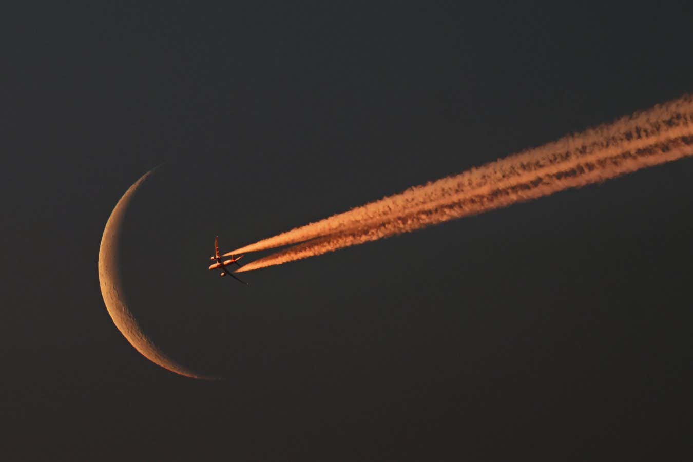 newscientist's tweet card. The conspiracy theory that bad actors use "chemtrails" from aircraft to poison us sucks energy from legitimate protest against aviation's effects on the climate, says Graham Lawton