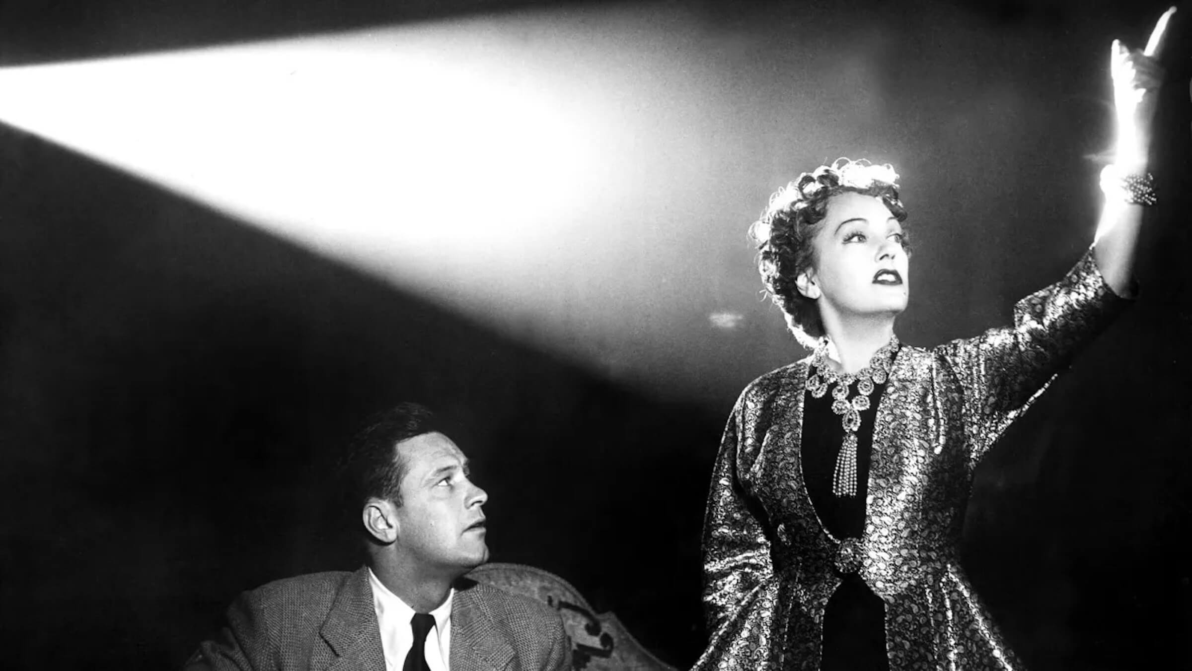 TheScriptLab's tweet card. What is film noir? Let's unpack the genre and our favorite films that encapsulate the genre and its tropes.