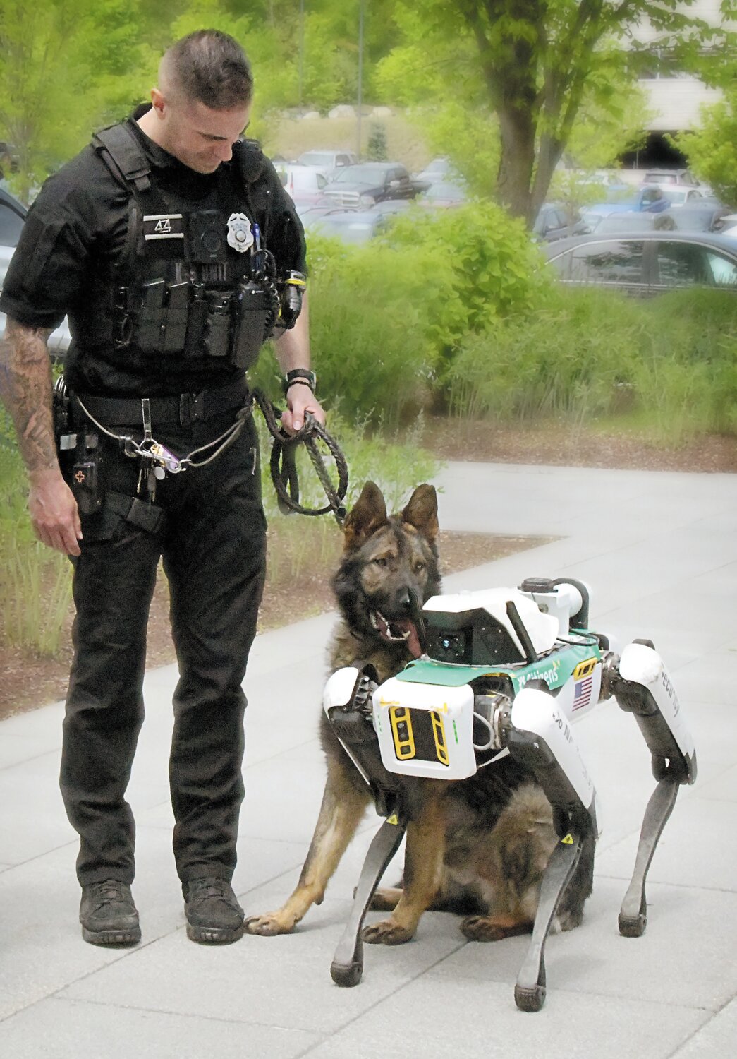 asylonrobotics's tweet card. Honza, meet Scout.  Technology met training last week when Honza, the Johnston Police Department’s new German Shepherd, met his robotic counterpart, Scout, at the Citizens Bank …