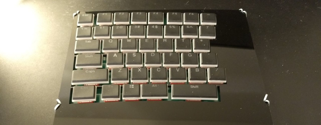 datacompboy's tweet card. So far, layout was chosen, all the elements were bought and pcb was built and flashed. While it's looks cool to type on bare board, this way to use it has some disadvantages: keyboard is slippery...