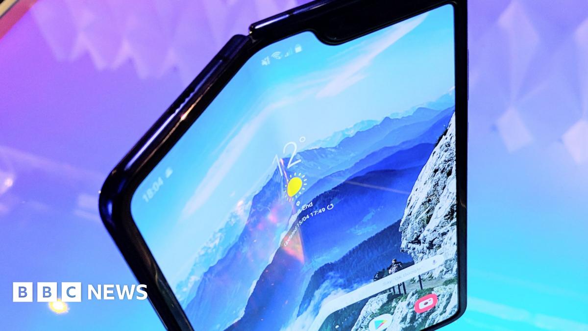 SOS_Comms's tweet card. Samsung delays the release of its foldable smartphone after reviewers report broken screens.