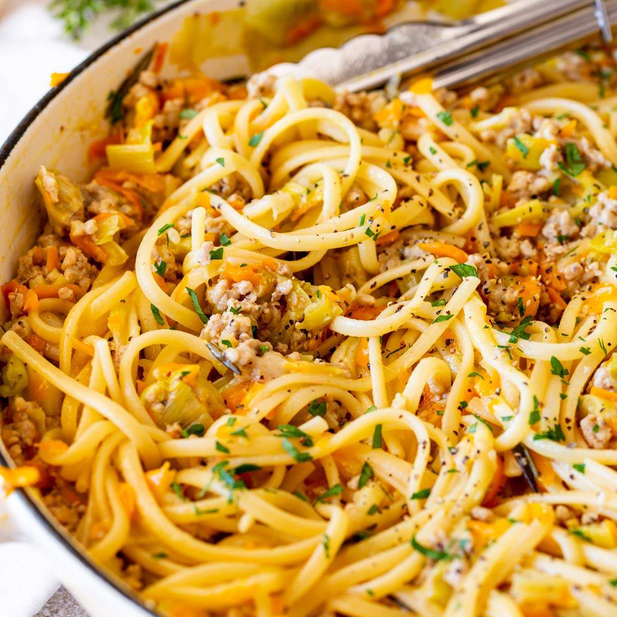 servfromscratch's tweet card. This ground pork pasta is a comforting, flavorful meal that’s easy to make! A hearty, sauce of pork, leeks, garlic, rosemary, and carrot.