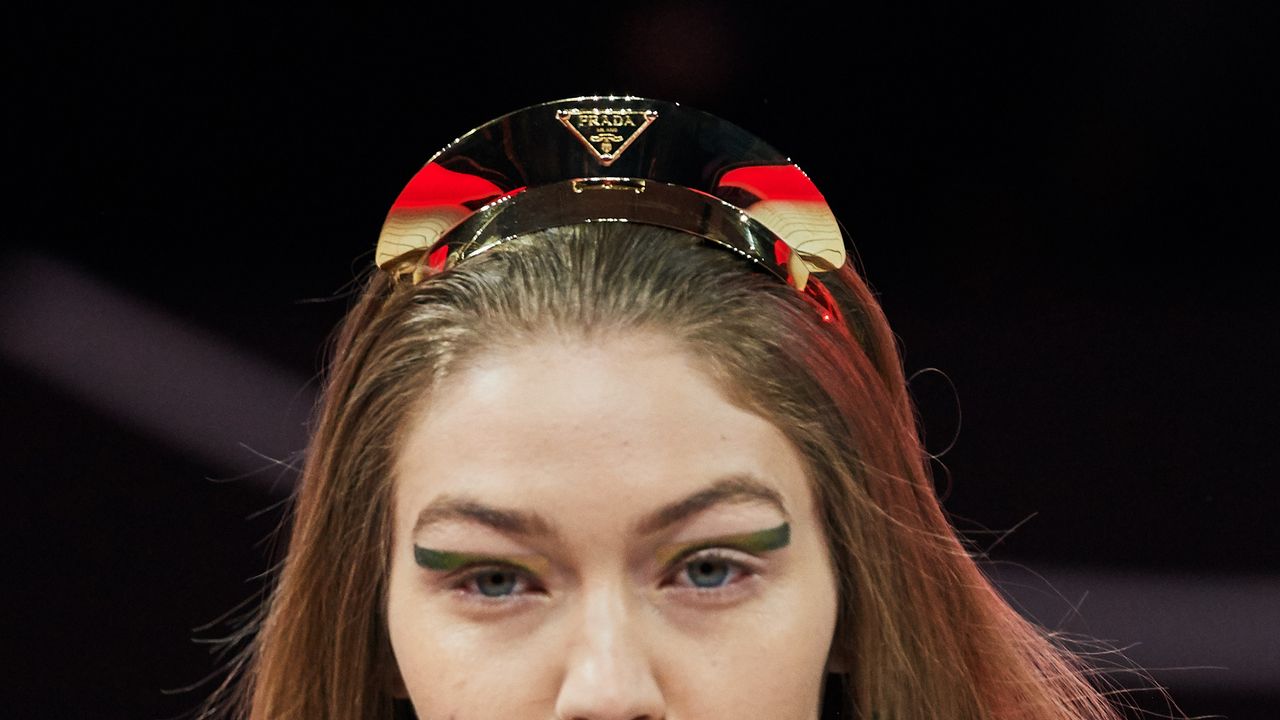 Proportion's tweet card. Padded headbands in primary colours are out, slender gold iterations with visor-like peaks are in