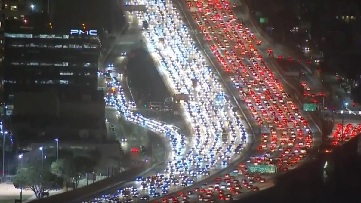 latimes's tweet card. Bumper-to-bumper traffic and a river of taillights have become as symbolic of the holiday in Los Angeles as Norman Rockwell's famous painting.