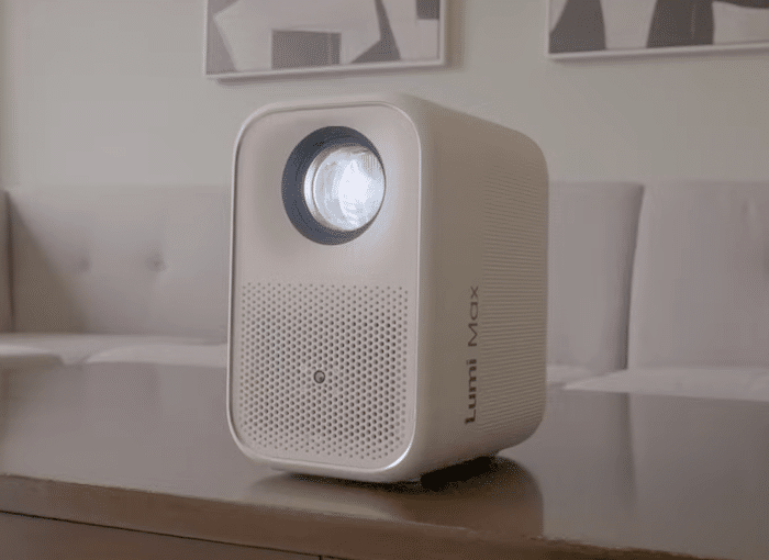 GadgetGram's tweet card. The Lumi Max Projector features 1080p video, 120" screen size, 5W speakers, 16GB storage, HDMI, USB and Aux ports, Bluetooth, Wi-Fi, and Google TV support.