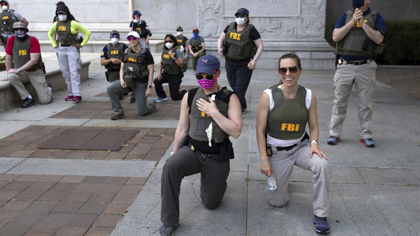 RaptorAttacker's tweet card. The FBI has fired agents who were photographed kneeling during a racial justice protest in Washington that followed the 2020 death of George Floyd at the hands of Minneapolis police officers.