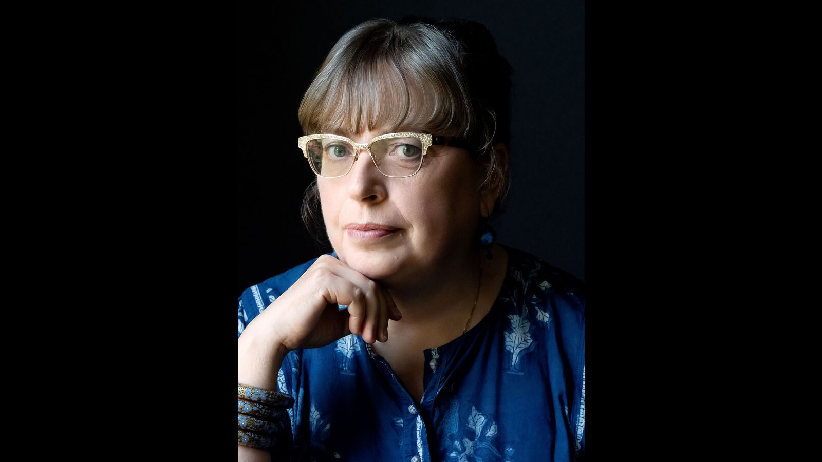 utterflea's tweet card. The author reflects on their creative journey, intertwining personal experiences with themes of ghosts, caregiving, and cultural identity in their upcoming novel.